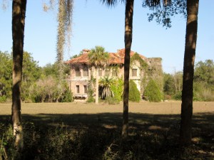 It seems that the 1930 photo with CC and Mr. Howey was taken at the southwest corner of the home. Howey did not allow pictures of the home unobstructed since it was a private residence. That is why palms were a convenient blocker in the 1930 picture. 