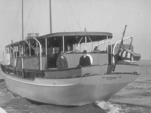 President Coolidge and another man, perhaps Secret Service, standing on the afterdeck of the Zapala. 