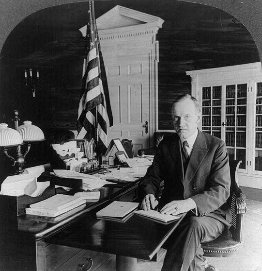 coolidge working at desk