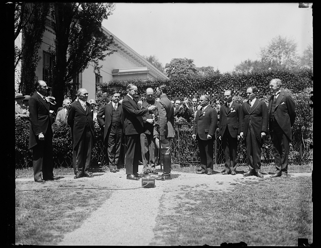 Captain Koehl of Germany being presented with the Distinguished Flying Cross by President Calvin Coolidge, at noon on May 2, 1928. 
