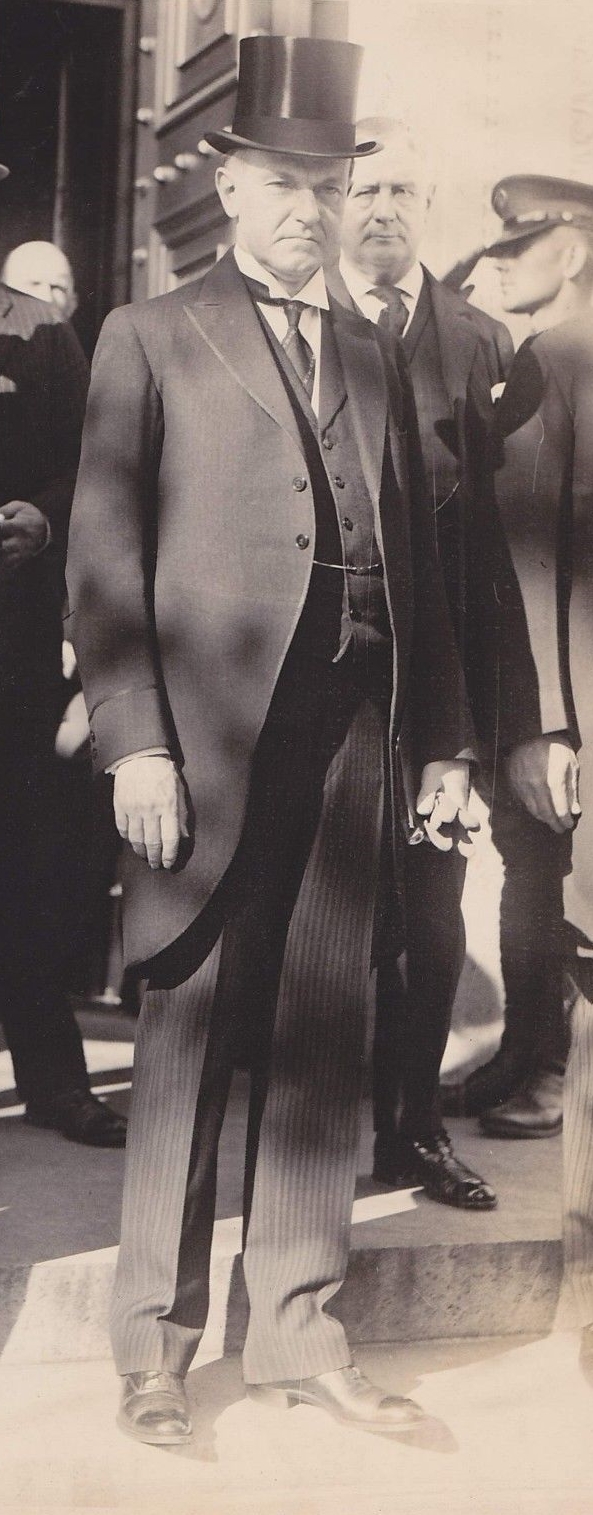 President Coolidge with Postmaster General New standing over his left shoulder.